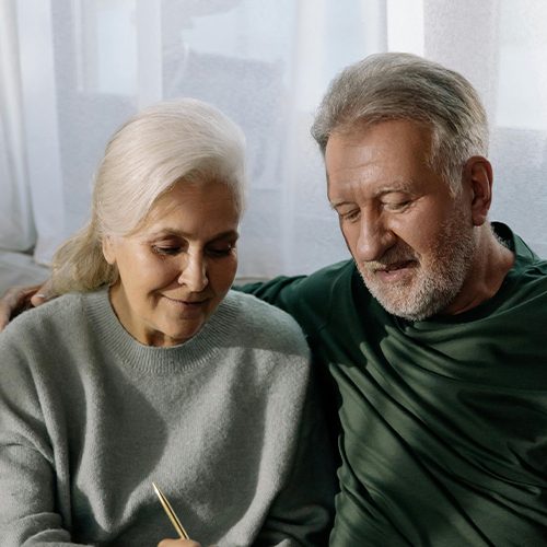 retired couple on computer